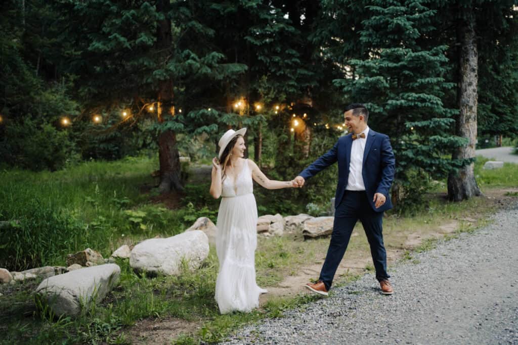 couple walking holding hands at blackstone rivers ranch