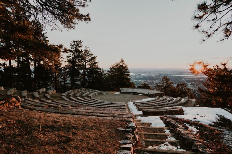 stone benches surround a stage at sunrise amphitheater overlooking boulder colorado
