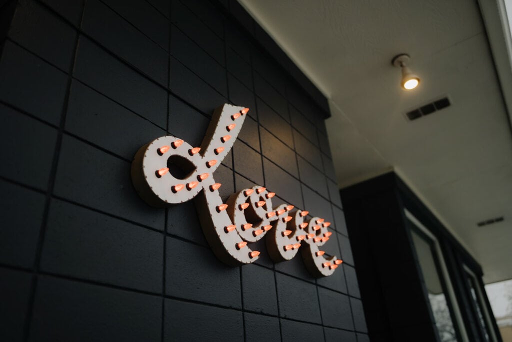 the iconic neon love sign on the front of Rembrandt Yard
