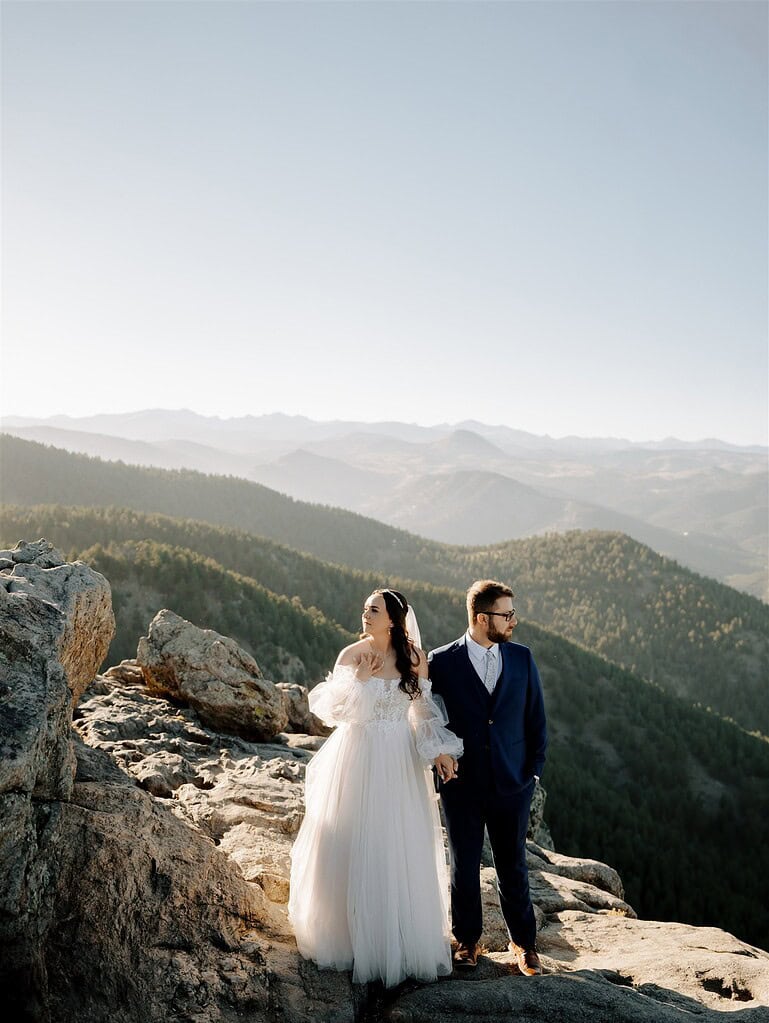 Bride and groom exchanging vows on rocky overlook at Lost Gulch Boulder Colorado mountain elopement with sunset light