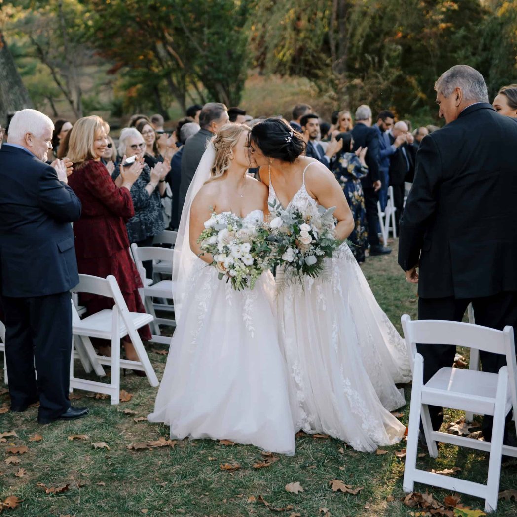 Tow brides kiss